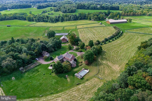 birds eye view of property featuring a rural view