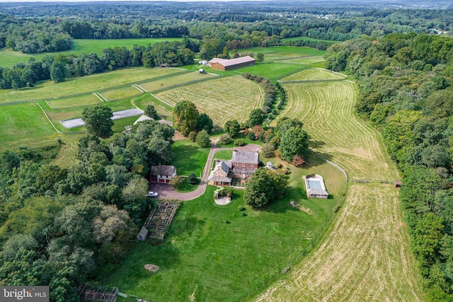 birds eye view of property with a rural view