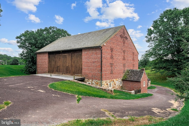 view of home's exterior featuring a lawn