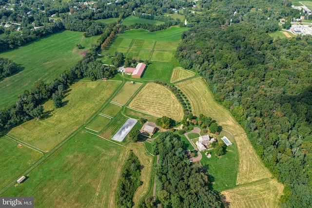 birds eye view of property with a rural view