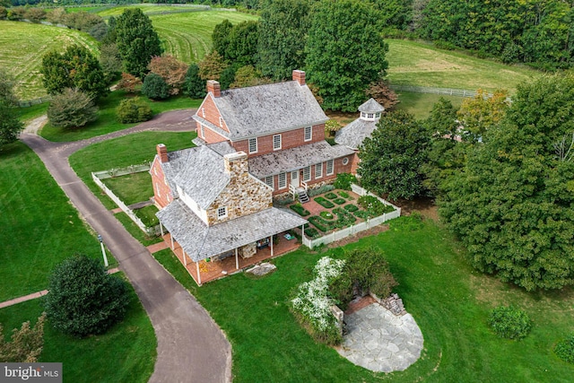 birds eye view of property with a rural view