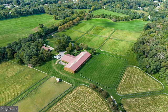 birds eye view of property with a rural view