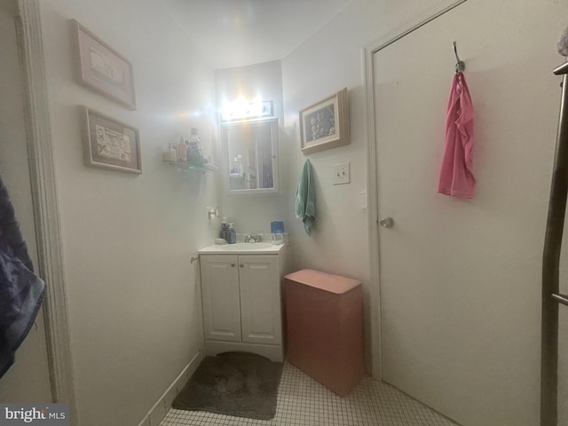 bathroom featuring tile flooring and oversized vanity