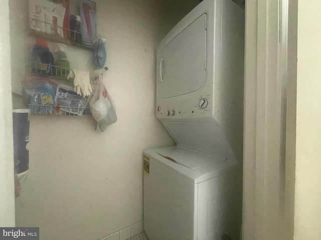 laundry area with stacked washer / drying machine