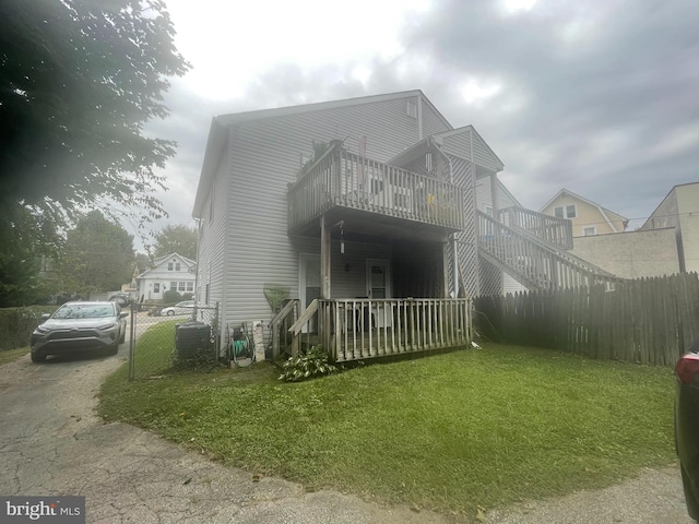 rear view of house with a lawn