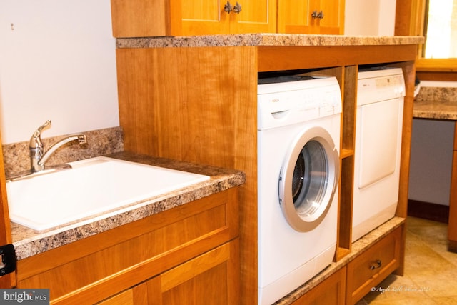 laundry room with washer / clothes dryer, sink, and light tile floors