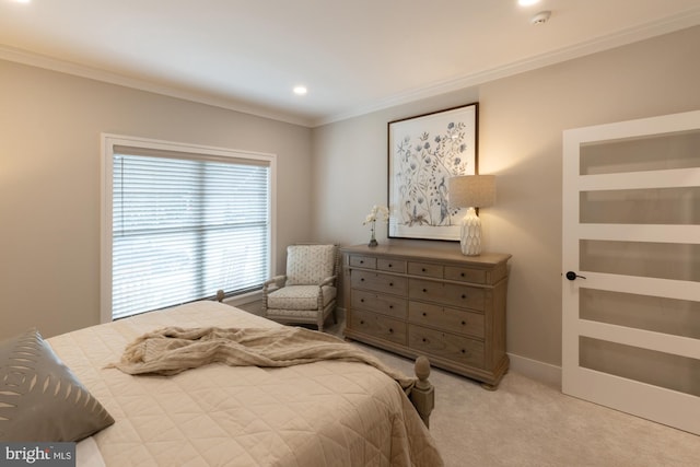 bedroom featuring crown molding and light carpet