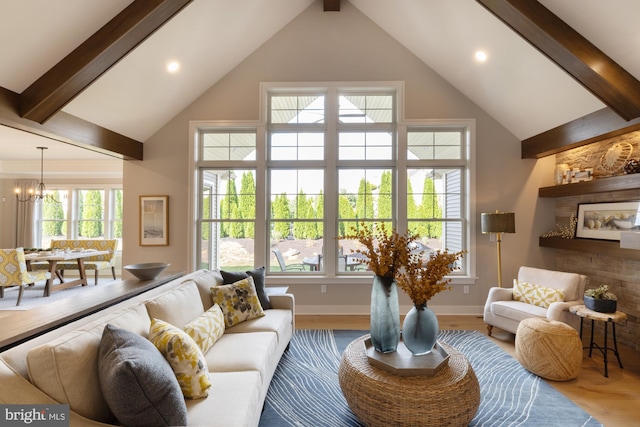 living room with beam ceiling, high vaulted ceiling, an inviting chandelier, and hardwood / wood-style flooring