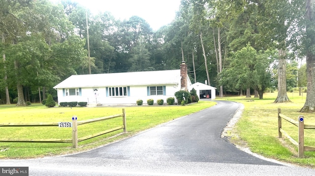 ranch-style house with a front lawn