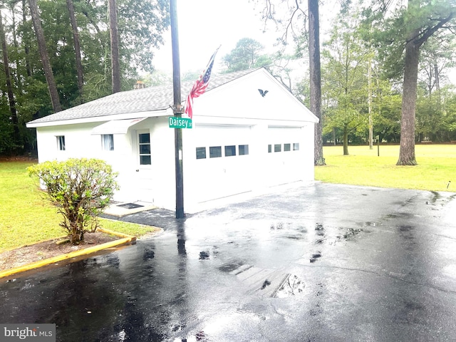 garage with a lawn