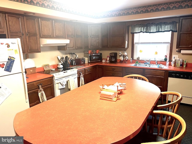 kitchen with sink, custom exhaust hood, and white appliances