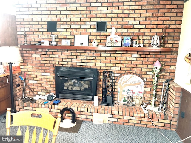 living room with brick wall and a brick fireplace