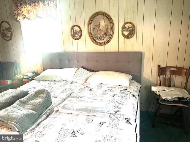 bedroom with wood walls