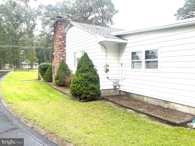 view of property exterior featuring a yard