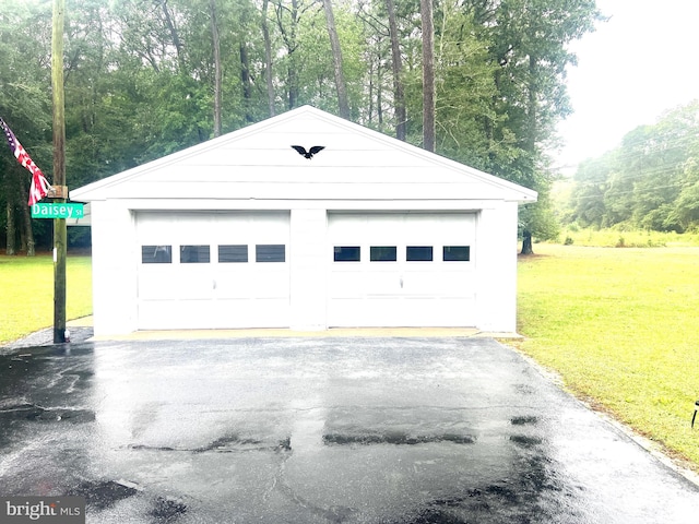 garage with a yard