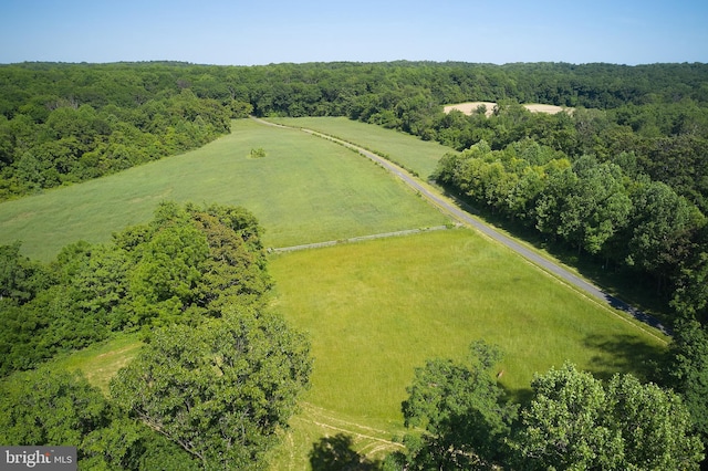 birds eye view of property with a rural view