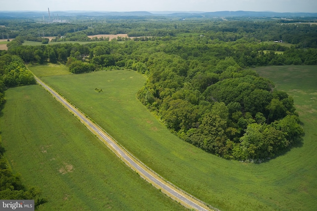 birds eye view of property featuring a rural view