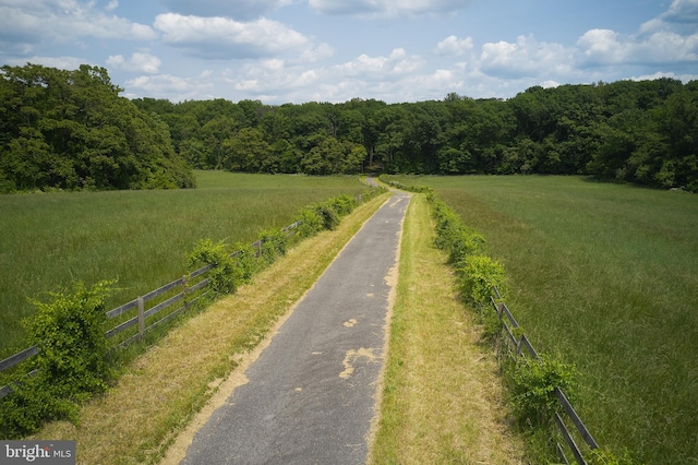 birds eye view of property with a rural view