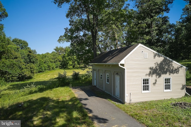 garage featuring a yard