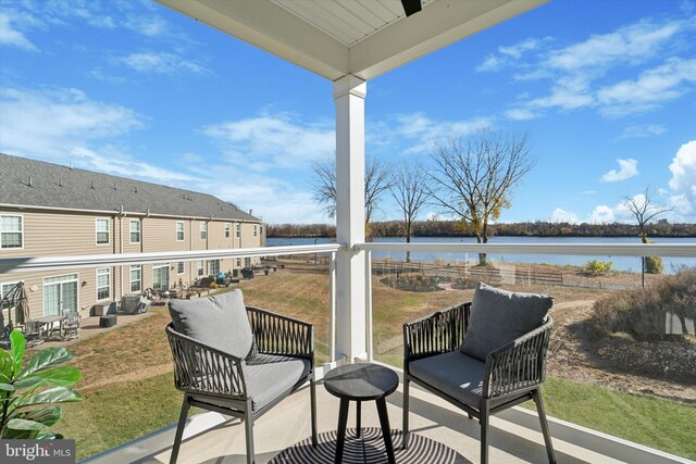 balcony featuring a water view