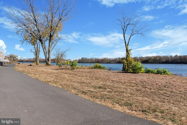 exterior space with a water view