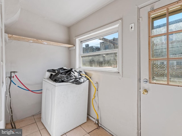 laundry area featuring washer / dryer and light tile flooring