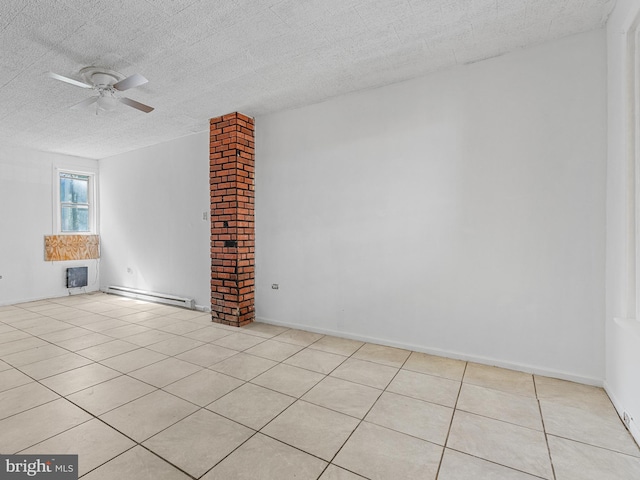 empty room with brick wall, light tile floors, ceiling fan, and a baseboard heating unit