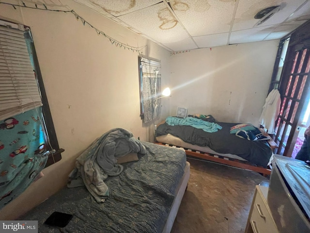 bedroom featuring a paneled ceiling