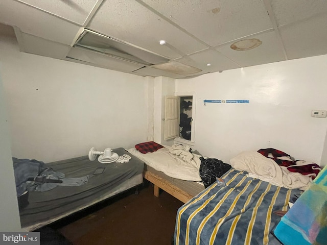 bedroom with a paneled ceiling