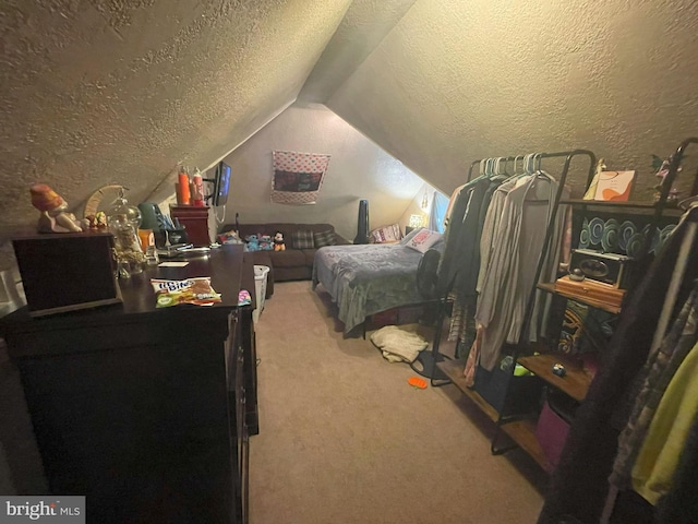 carpeted bedroom with lofted ceiling and a textured ceiling