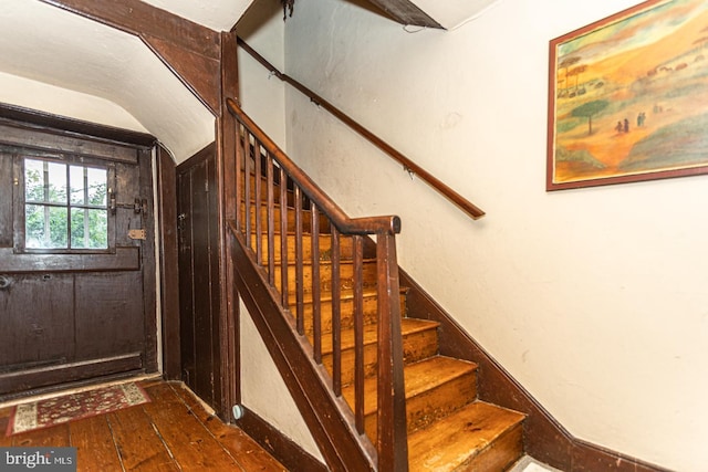 stairway featuring dark hardwood / wood-style floors