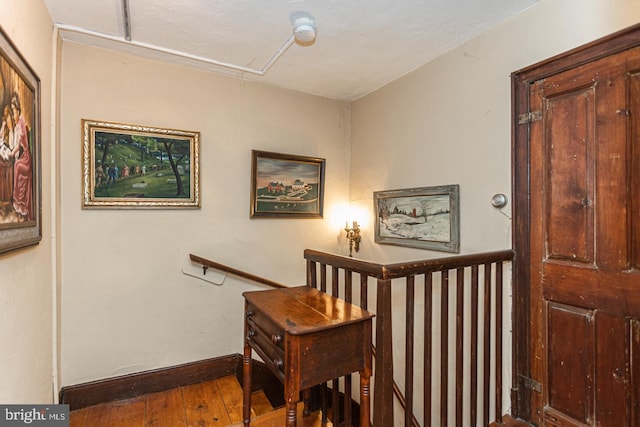 hallway with dark wood-type flooring