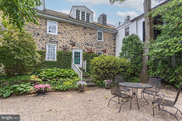 back of house featuring a patio area