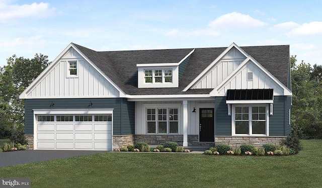 view of front facade with covered porch, a front yard, and a garage