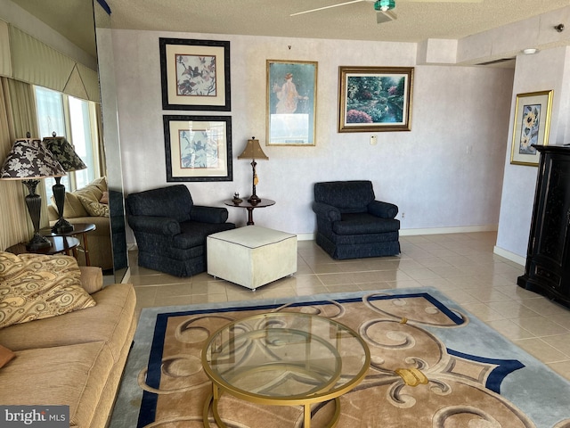 living room featuring a textured ceiling and tile patterned floors