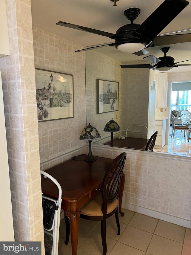 dining area featuring ceiling fan and light tile patterned floors