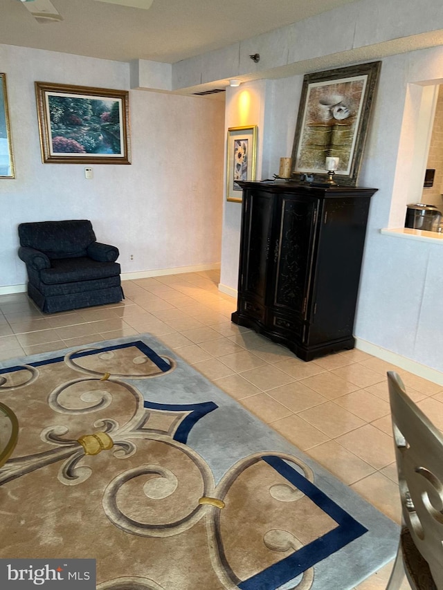 living room featuring light tile patterned flooring