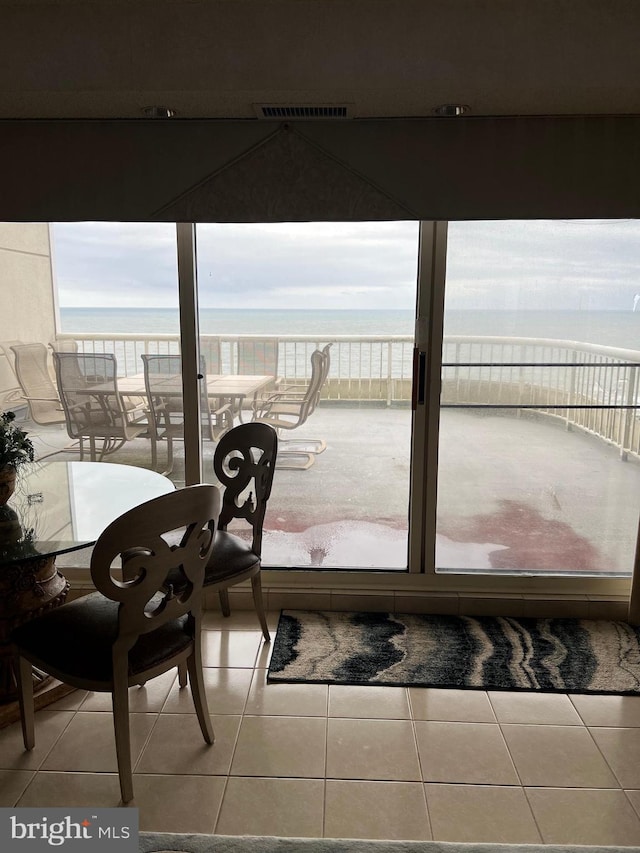 interior space with a healthy amount of sunlight and a water view