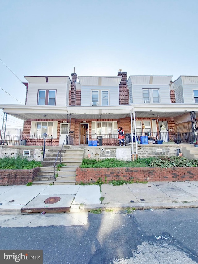 view of property featuring a porch