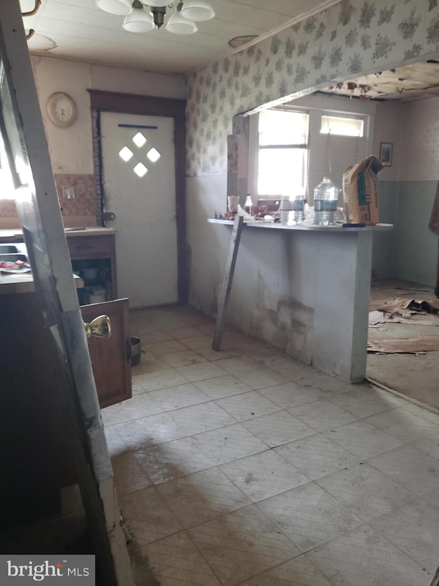 5348 Westford Rd, Philadelphia, PA 19120 - kitchen featuring wallpapered walls and a wainscoted wall