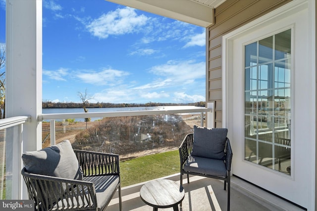 balcony featuring a water view