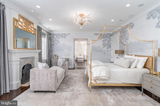 bedroom with crown molding and hardwood / wood-style floors