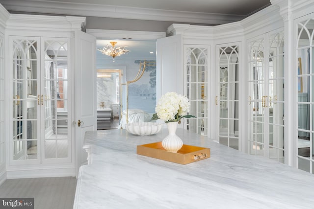 interior space featuring french doors and crown molding