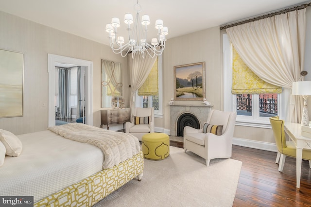 bedroom with hardwood / wood-style flooring and a notable chandelier