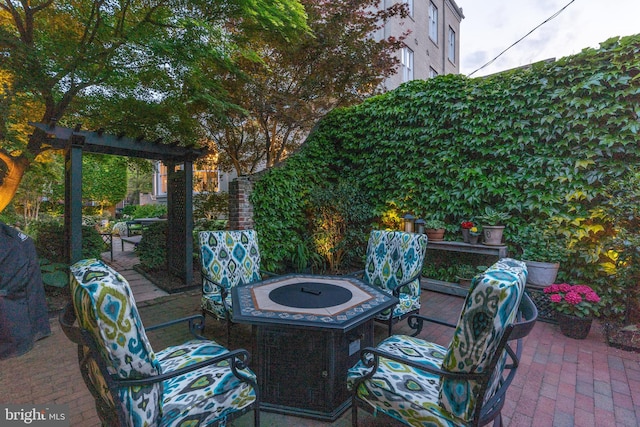 view of patio / terrace with an outdoor fire pit