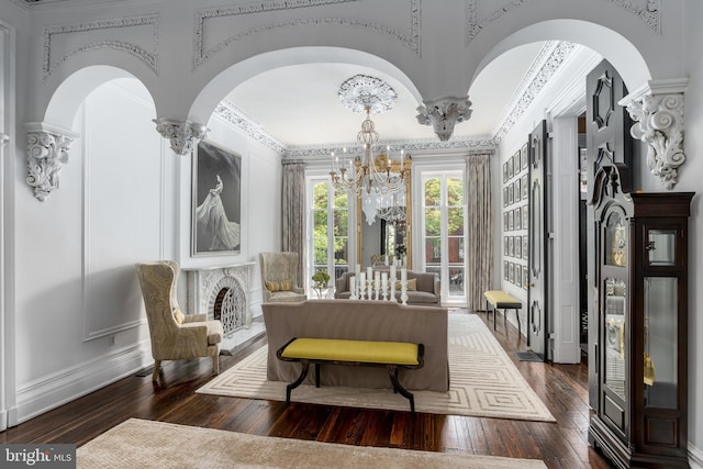 interior space with dark wood-type flooring and a chandelier