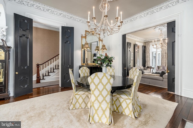 dining room featuring an inviting chandelier and dark hardwood / wood-style floors