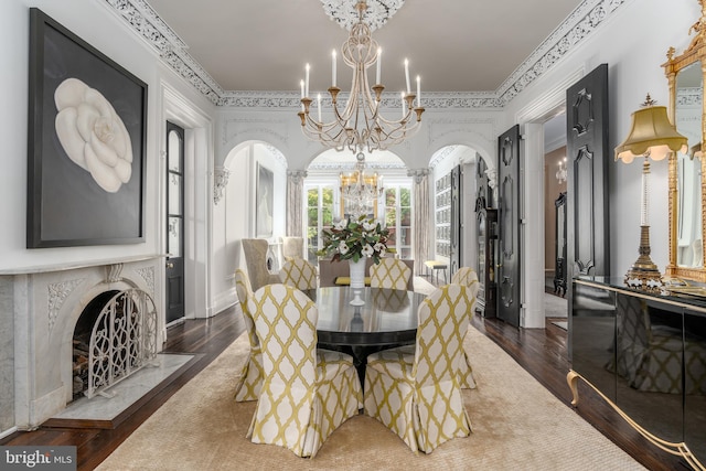 dining space featuring dark wood-type flooring and a chandelier