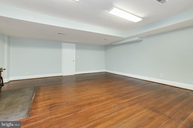 basement featuring dark wood-type flooring