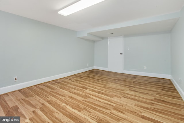 spare room featuring light wood-type flooring